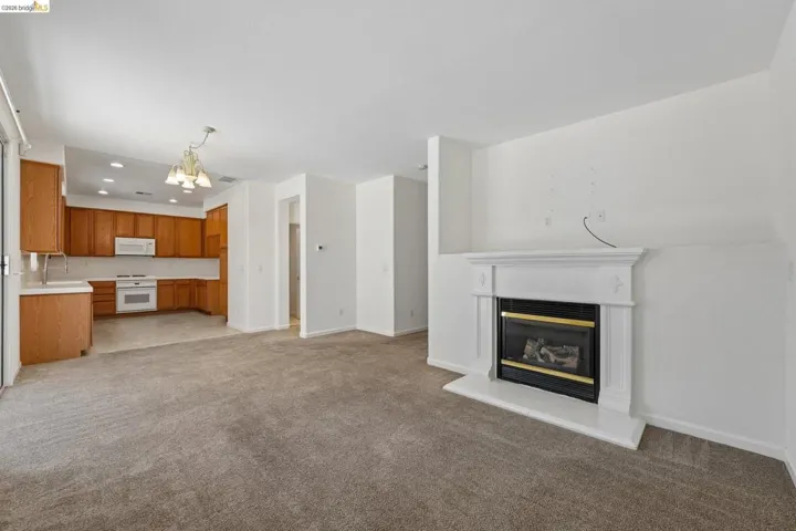 Living area with a white mantel fireplace