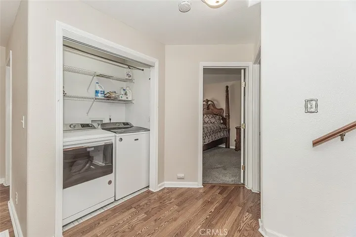 The half bath sits immediately behnd the laundry closet.  If you moved the laundry to the garage, you could open the back wall and put a shower in, providing another full bathroom!