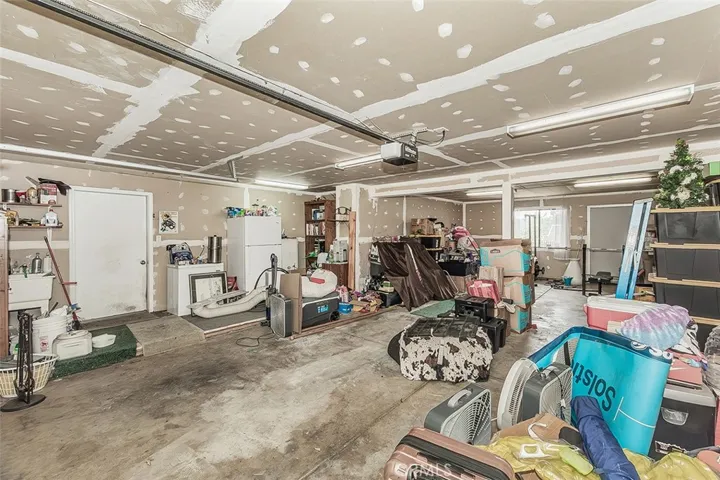 This tandem 4-car garage, plus work area on left side, will hold all of your vehicles or moutain toys.
