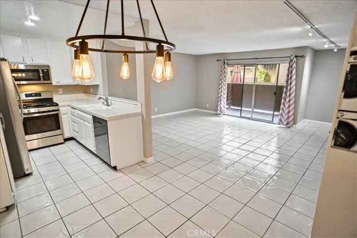 KITCHEN, DINING AREA AND LIVING ROOM
