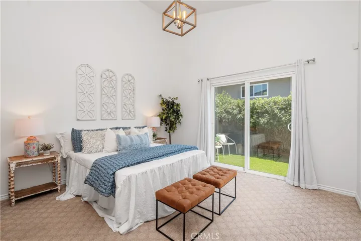 Primary bedroom w/sliding doors to the outside back patio area.