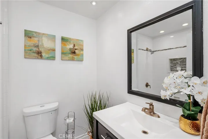 Main hallway bathroom with tub and shower.