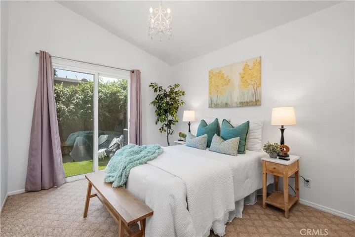 Second bedroom w/sliding doors to the back patio area.
