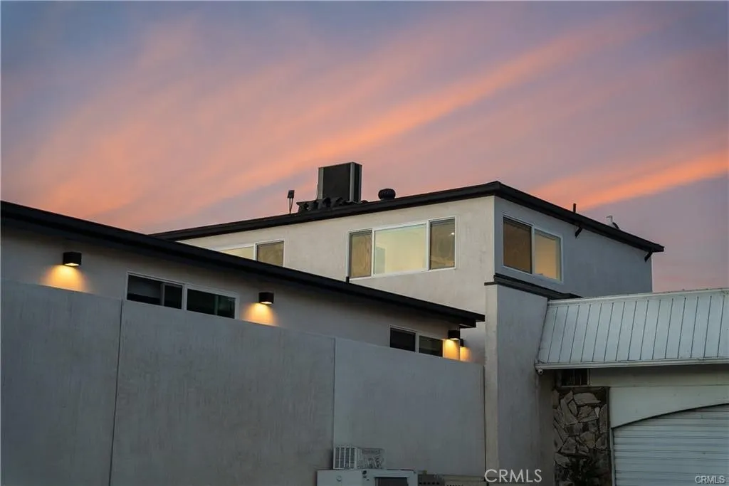 The 2 bedroom is the back unit, stand alone above garage