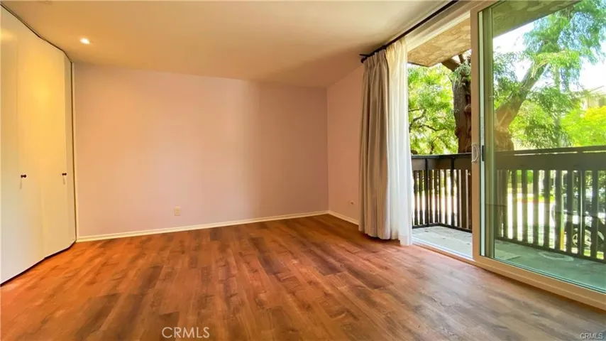 Primary Bedroom w/Large closets and w/sliders to Balcony