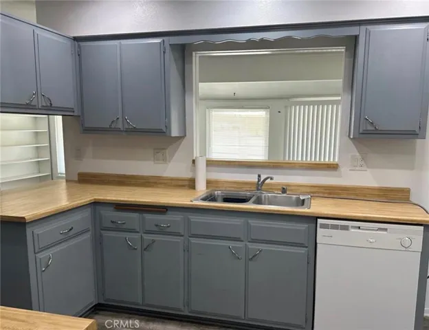 Large kitchen with opening to room addition.