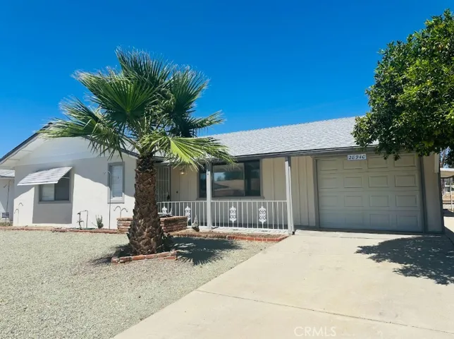 Nice covered porch and single car garage.
