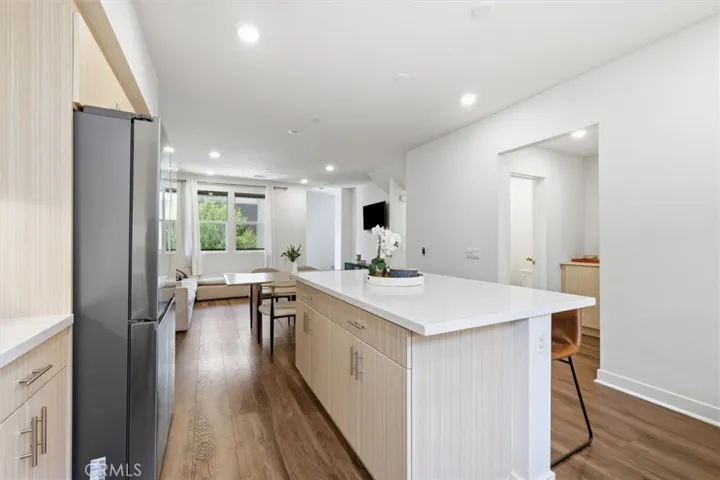 Main level kitchen opens to dining and living space
