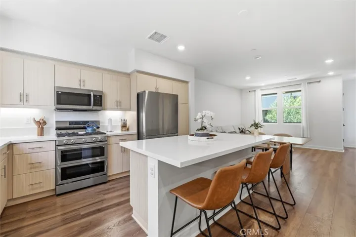 Main level kitchen opens to dining and living space