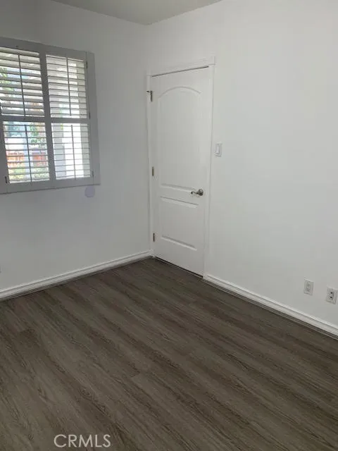 another view of bedroom with window