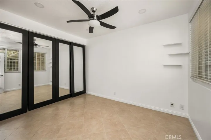Spacious secondary bedroom with plenty of natural light.