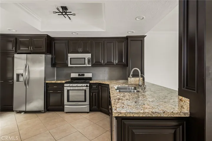 Granite countertops, stainless steel appliances & abundant cabinetry.