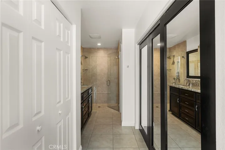 Primary suite featuring dual closets and ensuite bath.