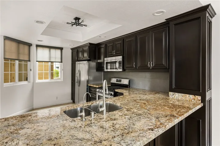 Kitchen opens seamlessly to the living room.