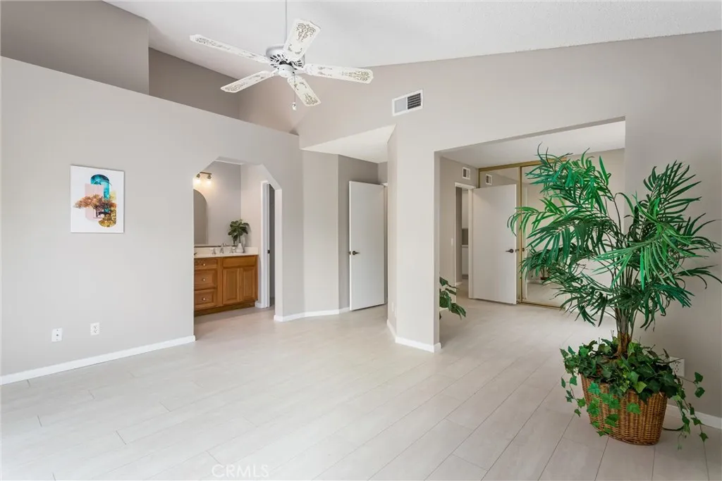 Primary suite to vanity in bathroom and retreat room
