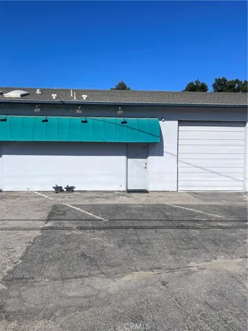 Front door entry + roll up door