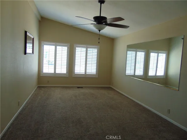 family room/formal dining room. Mirror stays