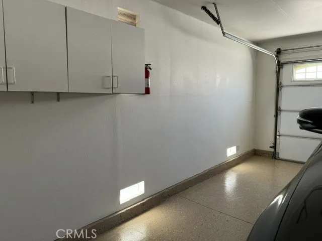 Easy to clean Epoxy Flooring in Garage more storage cabnets