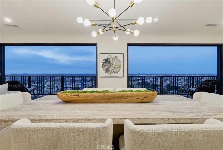 Dining with balcony and pano city view