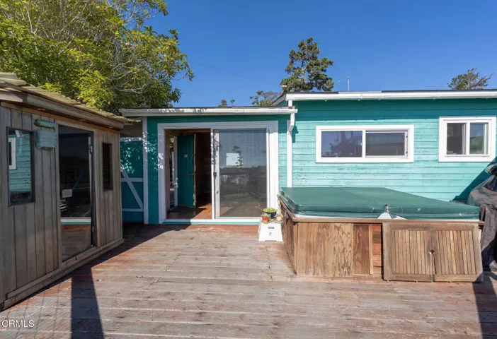 rear view of house and hot tub