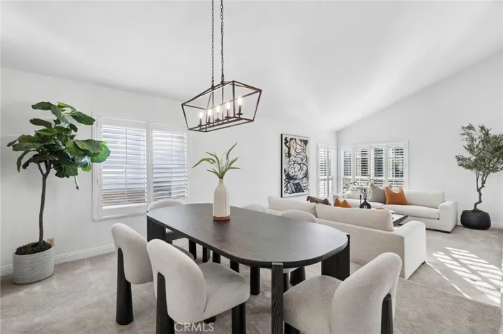 Formal living and dining rooms with soaring ceilings provide elegant spaces for gatherings