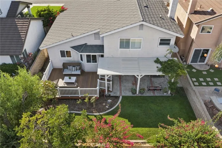 Additional highlights include dual-pane windows and sliding doors, updated bathrooms, custom built-ins, and numerous thoughtful upgrades reflecting true pride of ownership