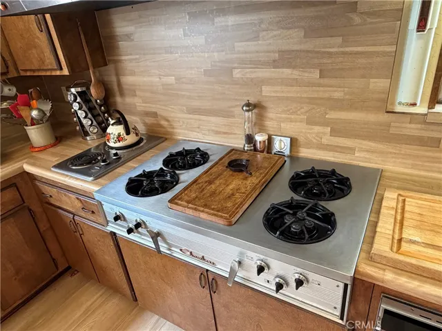 4 BURNER PROPANE RANGE WITH GRIDDLE AND 2 BURNER ELECTRIC RANGE