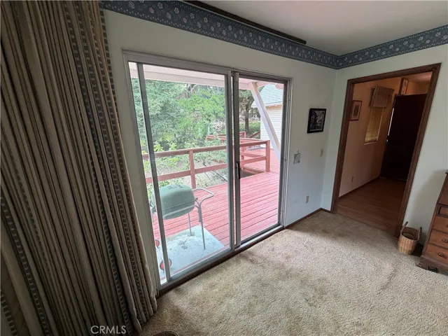 MAIN FLOOR BEDROOM OPENS TO FRONT DEDK