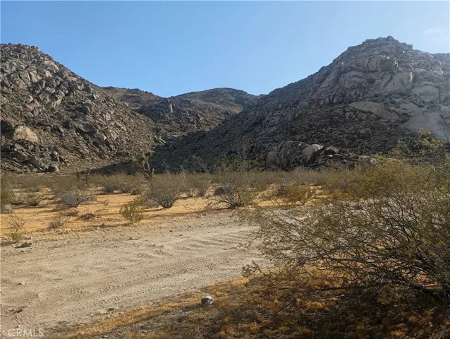 Looking Southwest across Cove Road at Granite Mountains from property