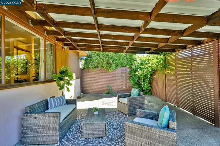 A welcoming private courtyard creates a memorable first impression and leads to elegant living spaces filled with warmth and character.