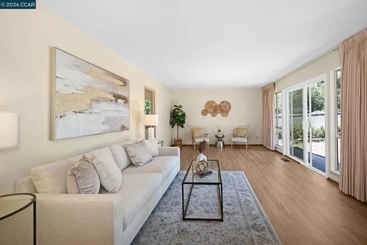 Newly installed luxury vinyl plank flooring and designer-selected paint palettes enhance the home-a fresh contemporary appeal.