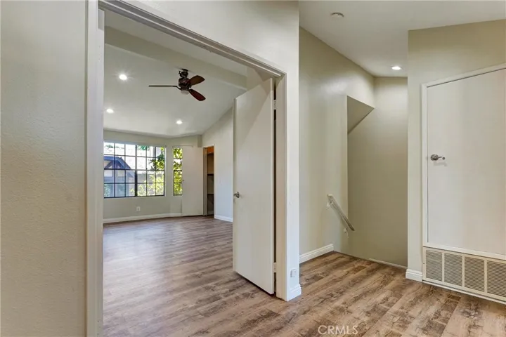 Hallway looking into primary bedroom