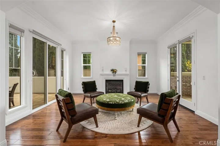 Living Room with access to outdoor courtyard and covered patio area at front yard area.