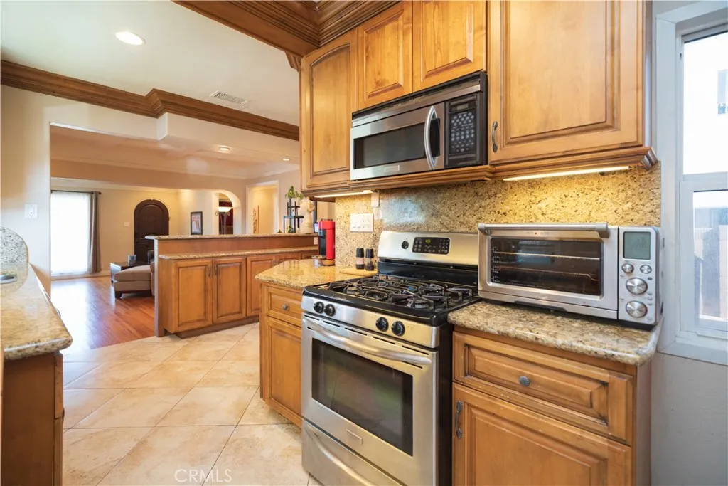 Updated Kitchen Granite countertops and Travertine floors.