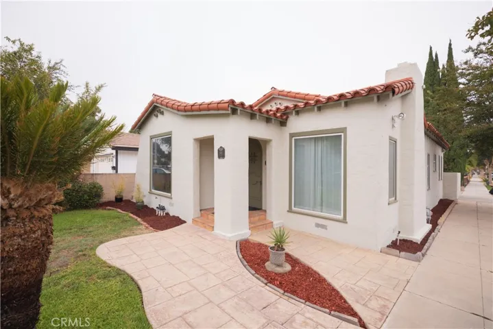 This lovely Spanish Style Home really delivers!