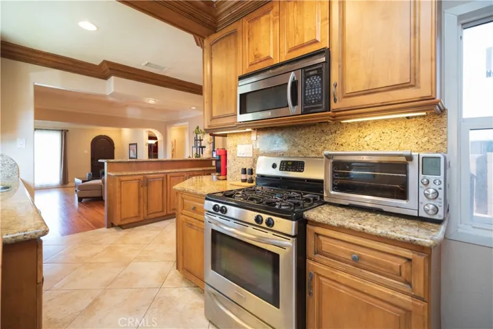 Updated Kitchen Granite countertops and Travertine floors.