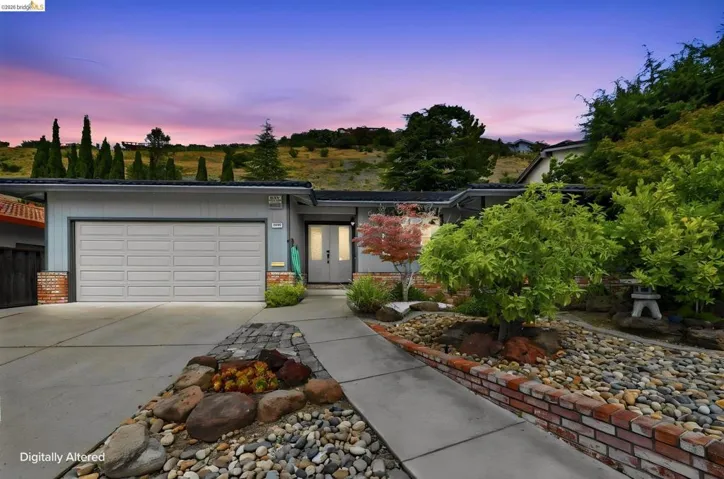 Contemporary-style residence with a two-car garage and a concrete driveway