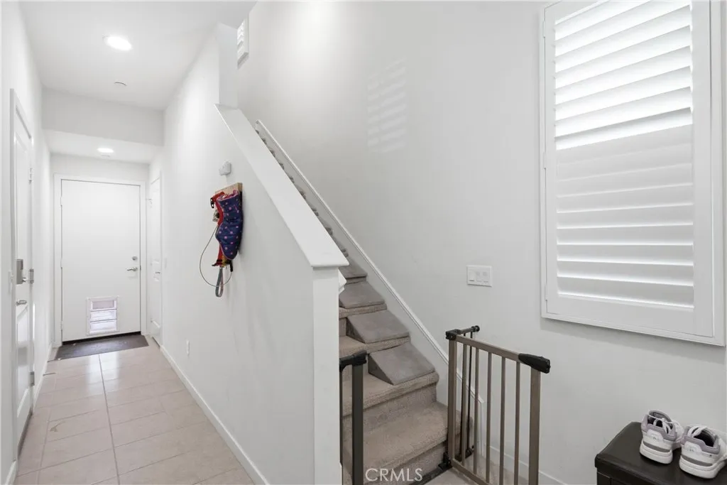Entry on 1st Floor leads to Garage side door and backyard straight ahead