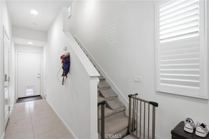 Entry on 1st Floor leads to Garage side door and backyard straight ahead