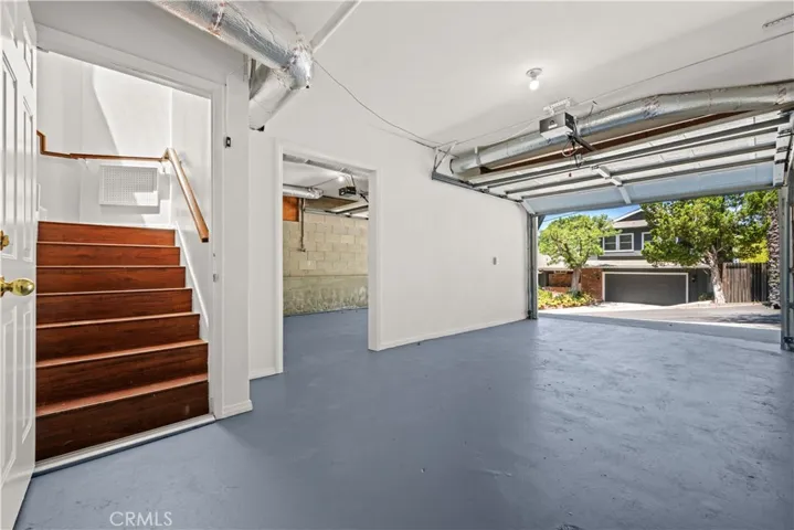 Left side garage facing house enters home has locked door and pass through to 2nd garage on the left.