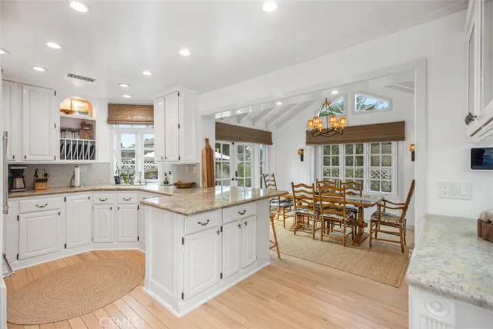Kitchen fully stocked with all of your kitchen needs as well as a wet bar nearby.