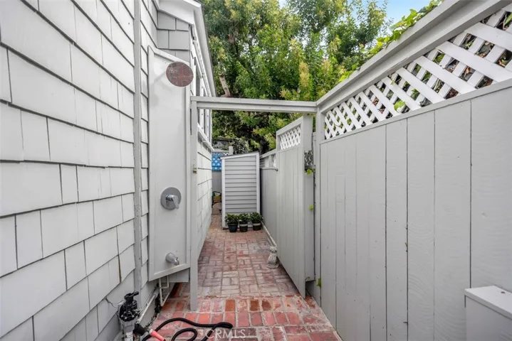 After a day at the beach an outdoor shower awaits you.