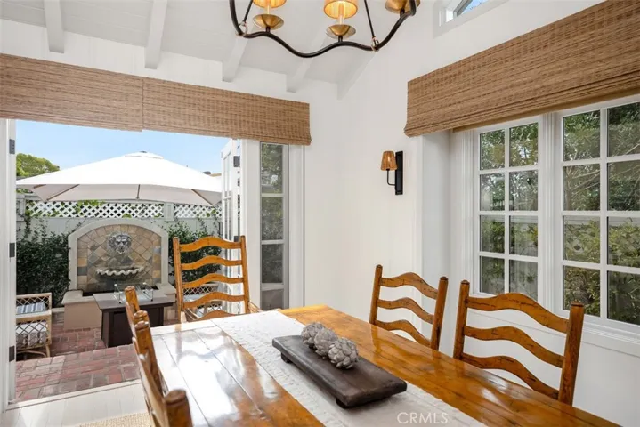 French doors lead out to a charming water feature perfect place to unwind after a long day.
