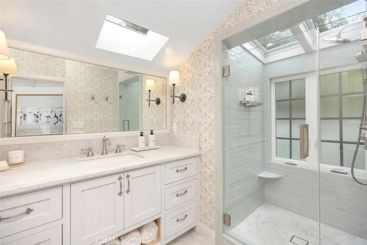 Another spa like bathroom in the primary suite with lots of natural light.