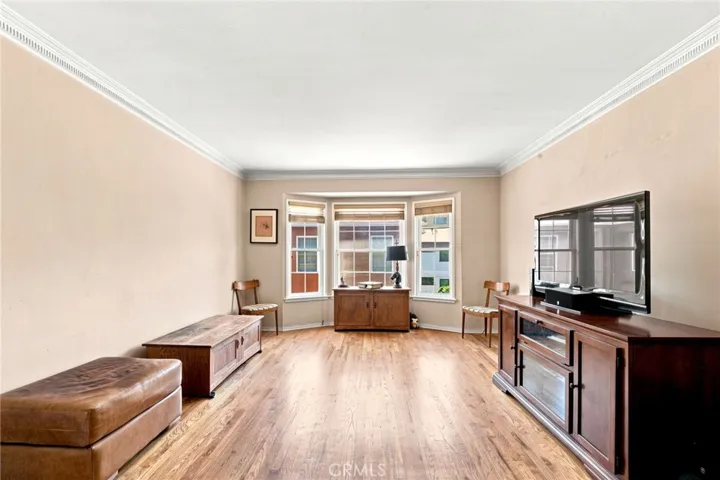 Living room/gleaming hardwood, flooded with light