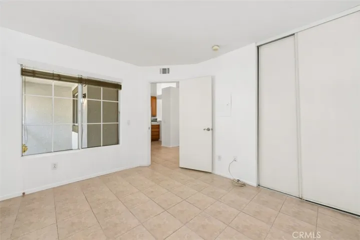 The convenient second bedroom has a porch view.