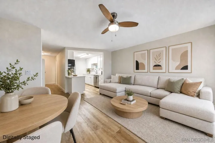 Spacious, open-plan living area with an electric fireplace, so you can enjoy the ambience without the heat on summer evenings (or have the heat as well in the winter months!). New flooring and dual-pane sliding door to large patio.