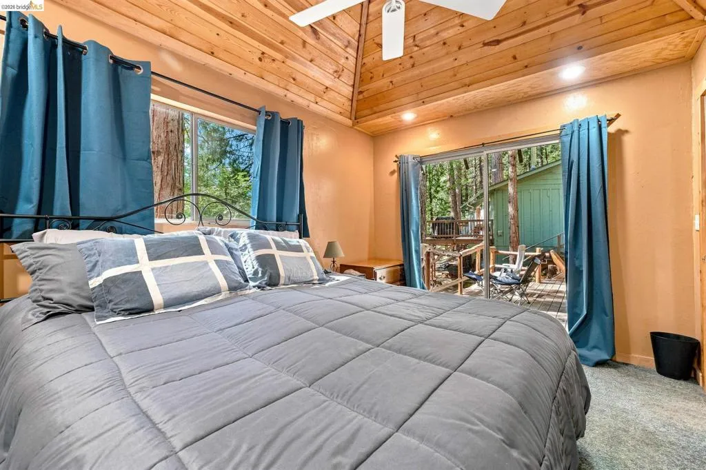 Bedroom featuring wood-finish vaulted ceilings, recessed lighting, and a ceiling fan