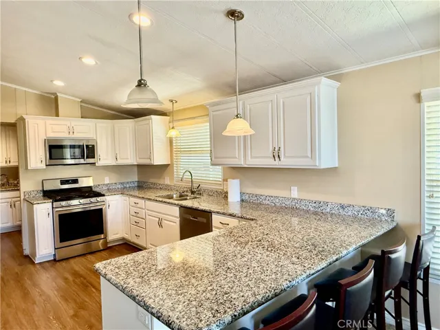 Kitchen is adjacent to laundry room