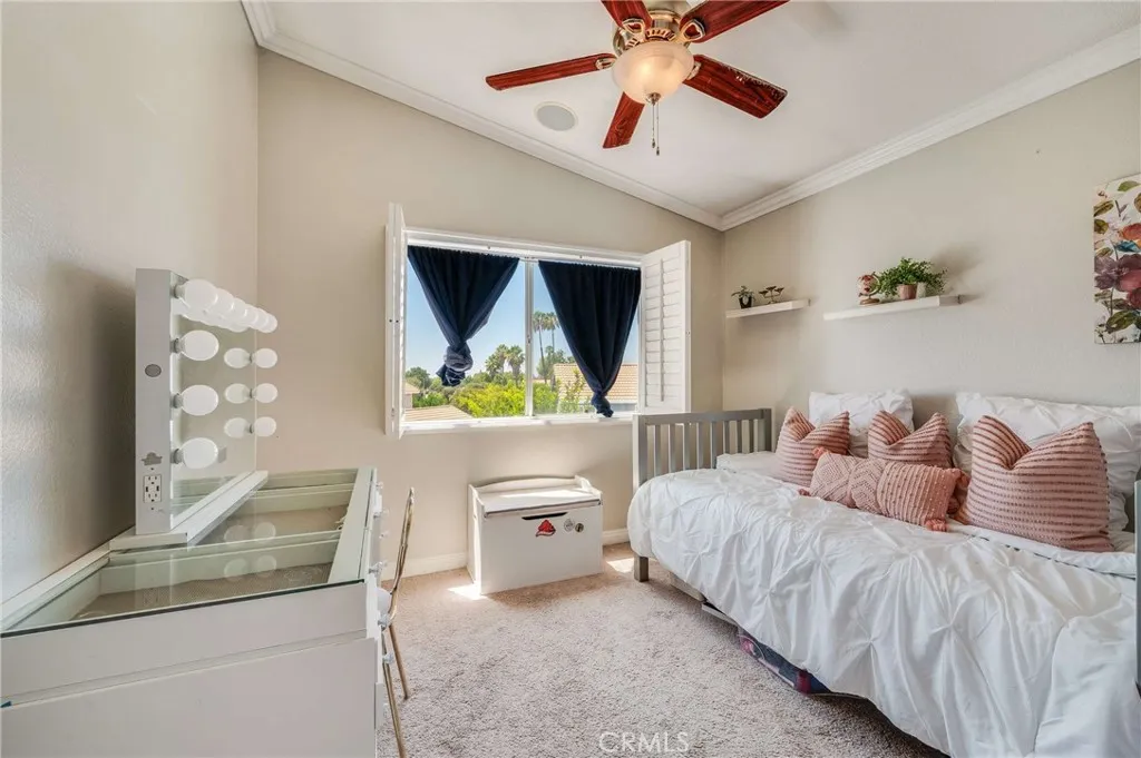 Bedroom #2 with High Ceilings, Ceiling Fan, Crown Molding, and Plantation Shutters